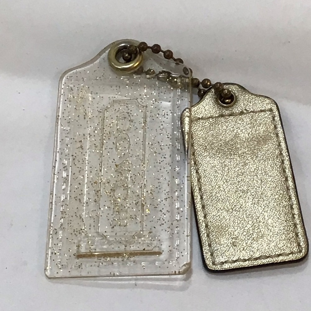 Two Coach hangtags